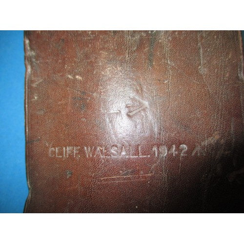 208 - A WWII machete with crows foot mark and original leather scabbard, in used condition, approx. length... 