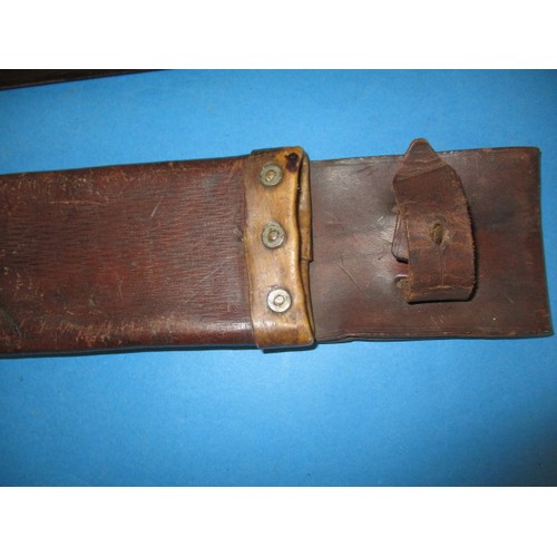 208 - A WWII machete with crows foot mark and original leather scabbard, in used condition, approx. length... 