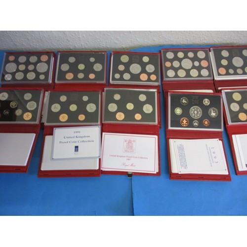 145 - Royal Mint United Kingdom proof coin sets in the red Deluxe version, 10 sets and all in original dis... 