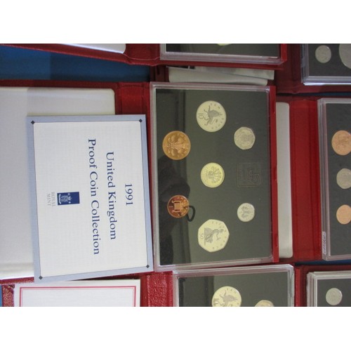 145 - Royal Mint United Kingdom proof coin sets in the red Deluxe version, 10 sets and all in original dis... 