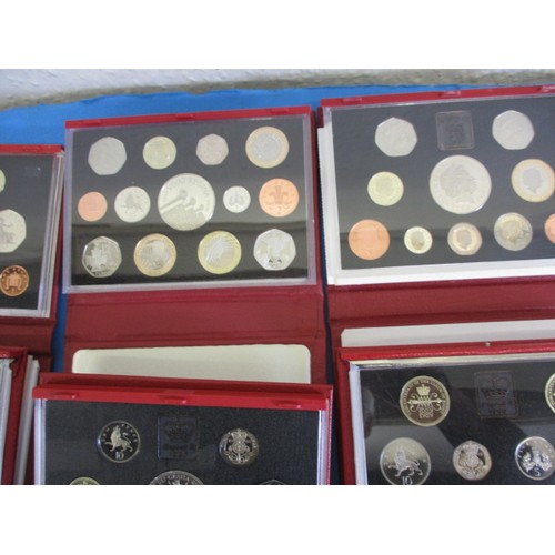 145 - Royal Mint United Kingdom proof coin sets in the red Deluxe version, 10 sets and all in original dis... 