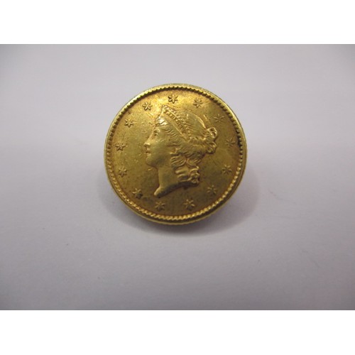 101 - An 1852 American $1 gold coin, a good grade with fine definition of features, approx. weight 1.7g