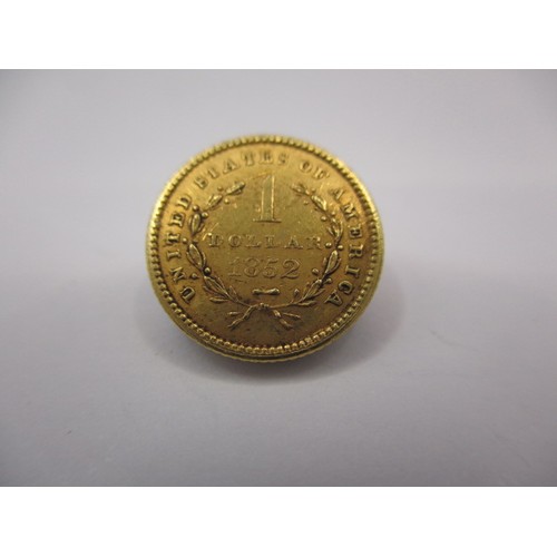 101 - An 1852 American $1 gold coin, a good grade with fine definition of features, approx. weight 1.7g