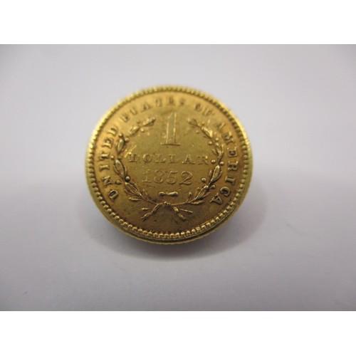 101 - An 1852 American $1 gold coin, a good grade with fine definition of features, approx. weight 1.7g