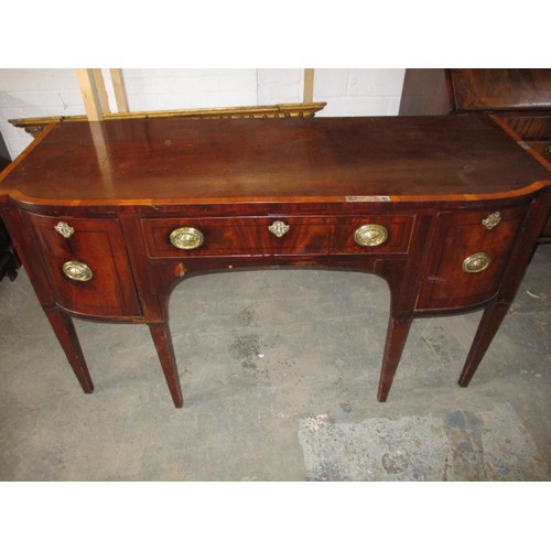 303 - A 19th Century sideboard. With 2 deep cellarette type drawers and central frieze drawer. Cross bandi... 