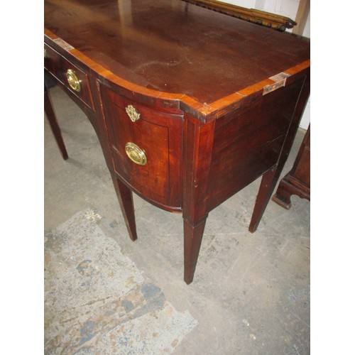 303 - A 19th Century sideboard. With 2 deep cellarette type drawers and central frieze drawer. Cross bandi... 