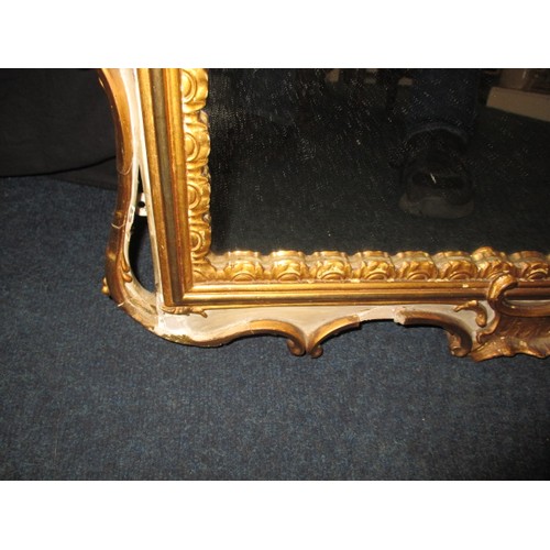 288 - A gilt framed wall mirror, approx. size 87x67, having some loss of gilding and general age-related m... 