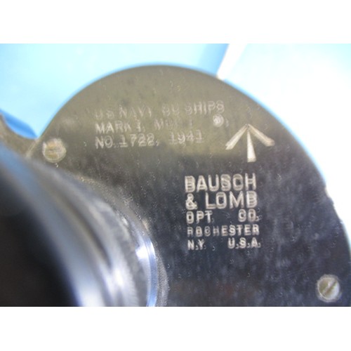 214 - A pair of US navy binoculars marked Bausch & Lomb and two brass compasses, one dated 1904, in used c... 