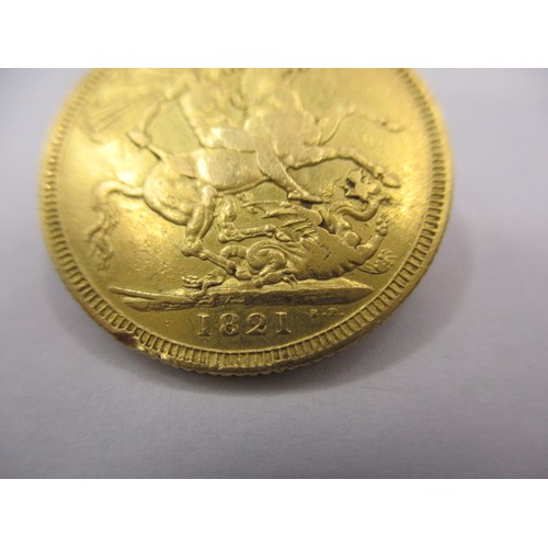 99 - An 1821 George IIII full gold sovereign, a circulated coin with good definition of features but havi... 