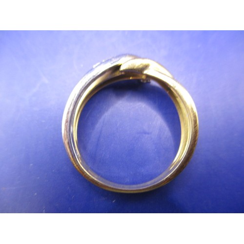 1 - A bi-colour foreign gold ring set with 4 small diamonds, approx. ring size ‘O’ approx. weight 3.5g i... 