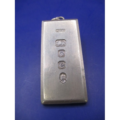 132 - A sterling silver ingot necklace pendant, approx. weight 52.8g in good used condition