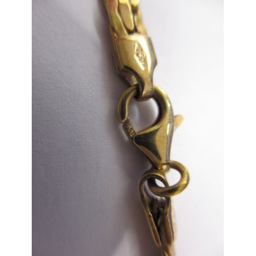 64 - An 18ct yellow gold necklace (approx. 10g) a 9ct yellow gold bracelet (approx. 10g) and a yellow met... 