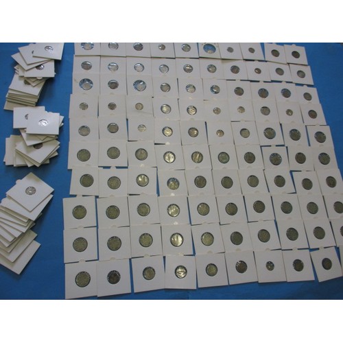 164 - A parcel of silver and part silver 3d and 6d coins, all in coin pouches and in circulated condition,... 