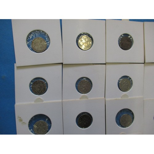 164 - A parcel of silver and part silver 3d and 6d coins, all in coin pouches and in circulated condition,... 