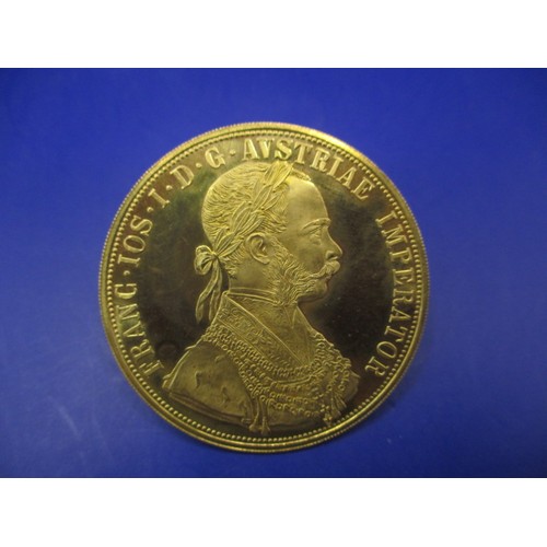 118 - An Austrian 4 Ducat gold bullion coin, dated 1915, approx. weight 14g approx. diameter 39.4mm approx... 