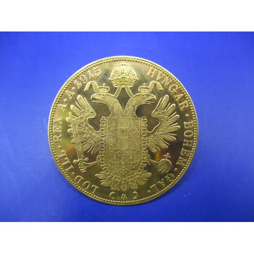 118 - An Austrian 4 Ducat gold bullion coin, dated 1915, approx. weight 14g approx. diameter 39.4mm approx... 