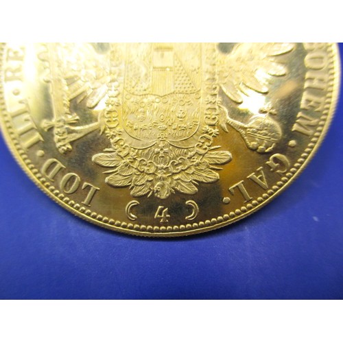 118 - An Austrian 4 Ducat gold bullion coin, dated 1915, approx. weight 14g approx. diameter 39.4mm approx... 