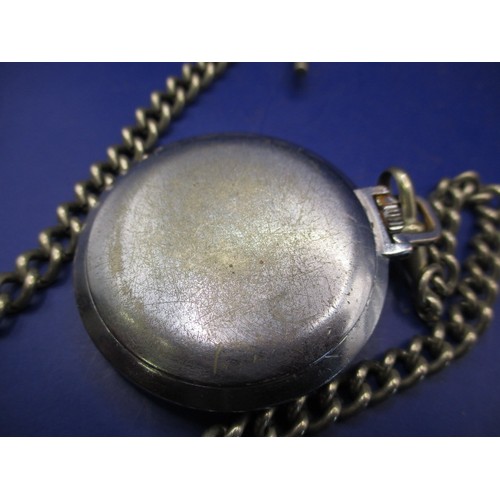 106 - A vintage Oris pocket watch with white metal Albert chain, in current working order with use-related... 