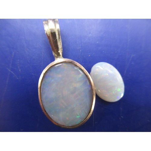 114 - Two vintage cabochon opals, one in a yellow metal pendant mount, approx. sizes 10.17mm x 7.22mm and ... 