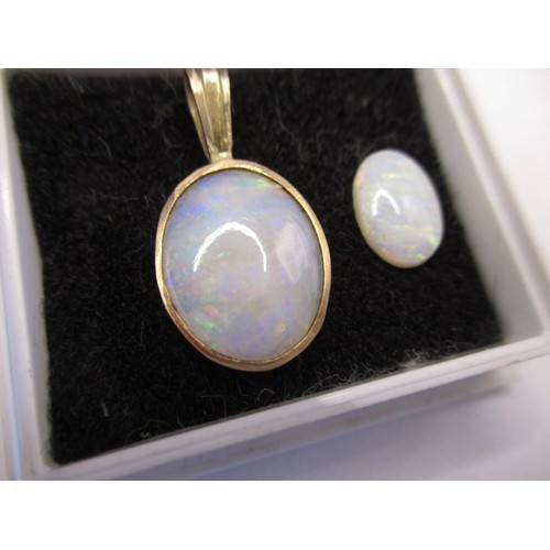 114 - Two vintage cabochon opals, one in a yellow metal pendant mount, approx. sizes 10.17mm x 7.22mm and ... 