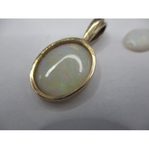 114 - Two vintage cabochon opals, one in a yellow metal pendant mount, approx. sizes 10.17mm x 7.22mm and ... 