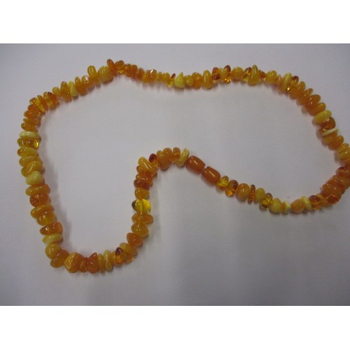 115 - A vintage genuine natural amber bead necklace, having various shaped and coloured beads, approx. lin... 