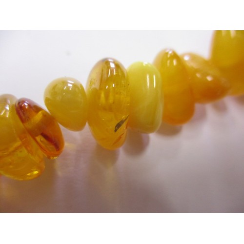 115 - A vintage genuine natural amber bead necklace, having various shaped and coloured beads, approx. lin... 