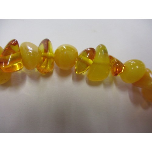 115 - A vintage genuine natural amber bead necklace, having various shaped and coloured beads, approx. lin... 