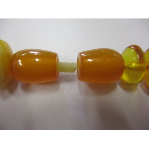 115 - A vintage genuine natural amber bead necklace, having various shaped and coloured beads, approx. lin... 