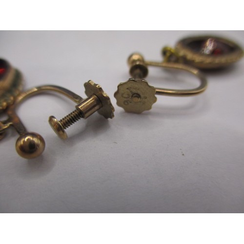 73 - A suit of antique gold and garnet jewellery to include a pair of screw on earrings and a ring, appro... 