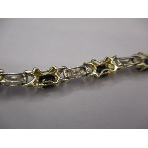 74 - A 14ct yellow and white gold, diamond and sapphire bracelet, approx. linear length 17cm, approx. wei... 