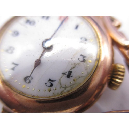 98 - A 9ct gold cased wrist watch marked Rolex to inside and a 9ct hard stone fob, watch has crack to dia... 