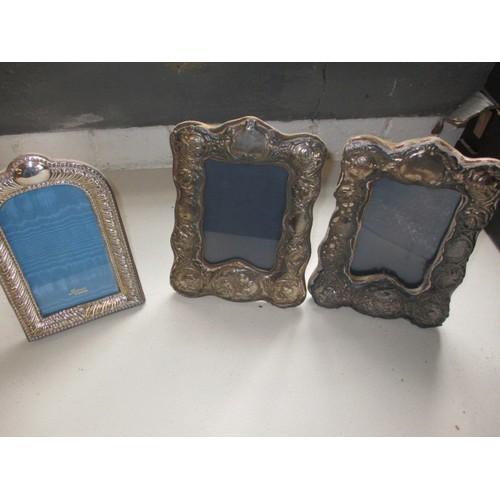 140 - A pair of vintage Sterling silver photo frames and a later example. All easel type, in useable condi... 