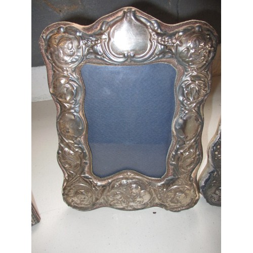 140 - A pair of vintage Sterling silver photo frames and a later example. All easel type, in useable condi... 