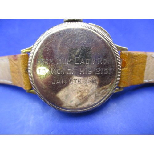 101 - A 1940s 9ct gold cased wrist watch, runs when wound, inscription to back dated 1941, having use rela... 