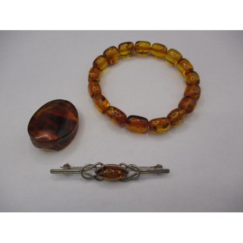 116 - A vintage genuine amber bead bracelet and a silver bar brooch with amber bead, and another piece of ... 