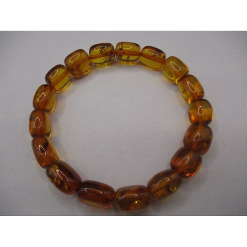 116 - A vintage genuine amber bead bracelet and a silver bar brooch with amber bead, and another piece of ... 