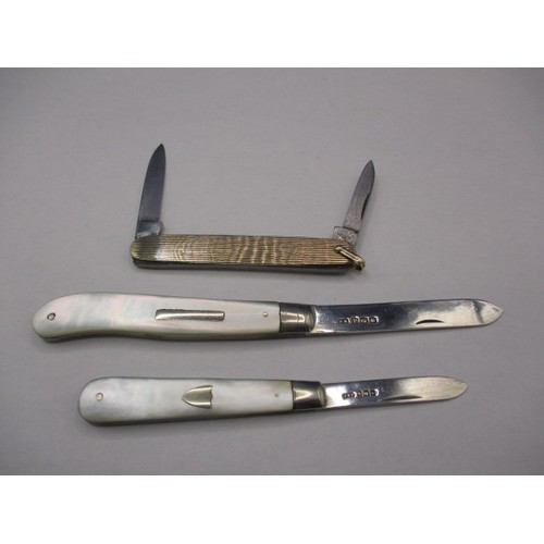 117 - Three vintage penknives, two antique with MOP and silver blades the other yellow metal example marke... 