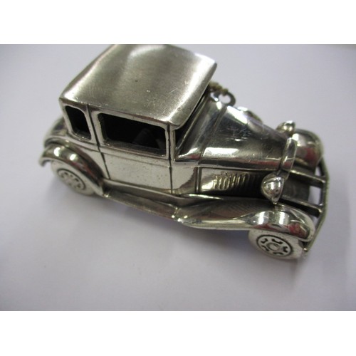 144 - A parcel of silver and white metal items to include a model A ford car, all in good used condition, ... 