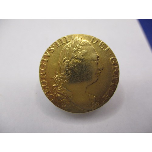 125 - A George III 1785 gold Guinea, approx. weight 8.3g approx. diameter 24mm, in very good + circulated ... 