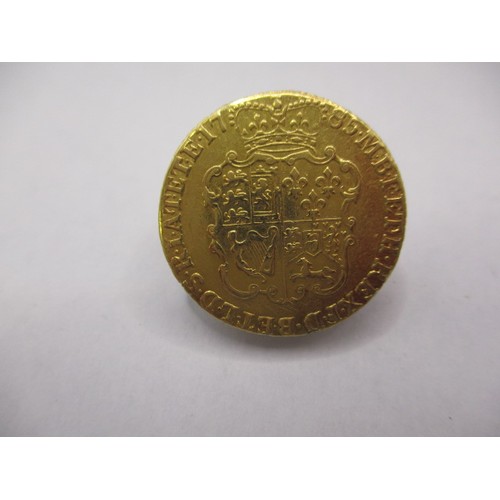 125 - A George III 1785 gold Guinea, approx. weight 8.3g approx. diameter 24mm, in very good + circulated ... 