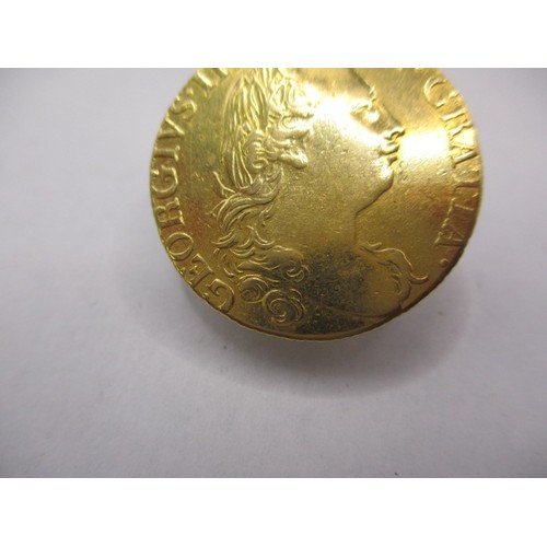 125 - A George III 1785 gold Guinea, approx. weight 8.3g approx. diameter 24mm, in very good + circulated ... 