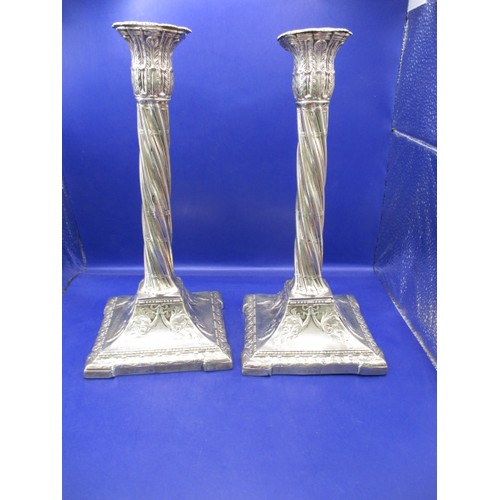 145 - A pair of late Victorian sterling silver candlesticks, approx. height 28cm, having use related marks... 