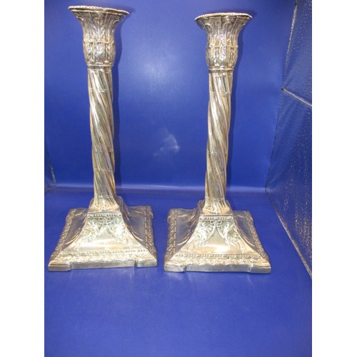 145 - A pair of late Victorian sterling silver candlesticks, approx. height 28cm, having use related marks... 