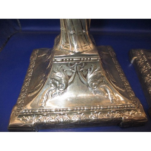 145 - A pair of late Victorian sterling silver candlesticks, approx. height 28cm, having use related marks... 