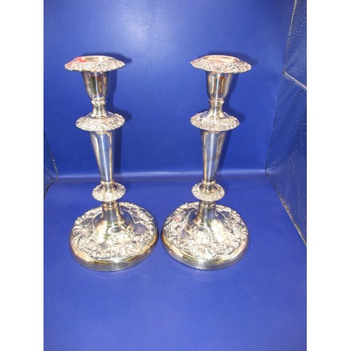 145 - A pair of late Victorian sterling silver candlesticks, approx. height 28cm, having use related marks... 