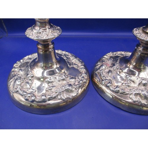 145 - A pair of late Victorian sterling silver candlesticks, approx. height 28cm, having use related marks... 