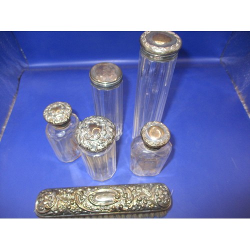 155 - A parcel of sterling silver top dressing table jars and a cigarette box, all in used condition, vari... 