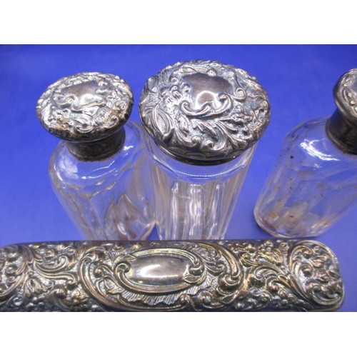 155 - A parcel of sterling silver top dressing table jars and a cigarette box, all in used condition, vari... 