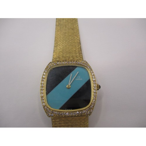 103 - A vintage 18ct gold cased gents dress watch with integral gold strap, the dial and movement marked O... 